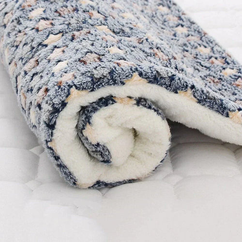 Rolled-up soft fleece pet blanket with pattern for comfort